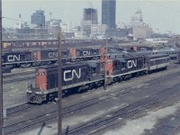 This is my first time posting.  I just found a large set of prints that my father, Aron, took in and around Toronto in the early 1970's.  Mostly CN but some CP as well.  The image quality is not the best but there are some great old photos here and if the group likes them I will keep scanning them and posting.  This is one of many from Spadina roundhouse where I remember going as a small kid and being somewhat terrified of all the big loud locomotives.  There was a stairway right off the Spadina Rd. bridge and you could just walk right down to the roundhouse.  Those were the days!
