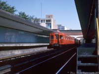A train of the original TTC "Red Rocket" subway cars, lead by G1 5011, pull into Rosedale Subway Station on a sunny Saturday morning on August 15th 1964, as viewed from track level at the south end of the station (a big no-no today, but things tended to be more lax back in the day). The shiny glass Vitrolite tiles that varied at each station (Rosedale's were eggshell green with black trim) are accentuated in the outdoor lighting, and were a style typical of all stations on the original Yonge subway line when it first opened until renovations and replacements phased them out at all stations except Eglinton.
<br><br>
The red Gloucester "G"-series steel subway cars (built as classes G1, G3, G4, plus six experimental aluminum G2 cars) were the sole equipment purchased for and used on the Yonge Subway line until new MLW-built aluminum M1 cars arrived two years earlier in 1962 for the University line extension. Despite new orders over the years from MLW, Hawker Siddeley and UTDC/Can-car, the venerable G's would continue to see extensive use on the system until the last cars were retired in the early 90's. The final two G1's built, 5098 and 5099 (used on the inaugural Yonge line opening day train on March 30th 1954) were set aside for preservation and donated to the Halton County Radial Railway museum, where they currently reside today on display and open for visitors.
<br><br>
<i>John F. Bromley photo, Dan Dell'Unto collection slide</i>