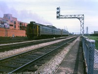 VIA RDC-1 6109 trails a sister RDC operating on train #652 as they depart downtown Toronto in a cloud of Detroit Diesel exhaust, heading eastbound over the Lower Jarvis St. rail viaduct and past the Crombie Park apartments. According to period timetables, #652 "The Ontarian" was a daily (except Saturday) Toronto-Kingston run departing 13:00 from Toronto's Union Station. One of the many runs still handled by Budd RDC's or "Railiners" (in CN parlance) at the time.
<br><br>
VIA 6109 was one of many RDC's purchased secondhand by CN: originally built for the Chicago & Eastern Illinois as their "RDC-1", and purchased by CN in 1964. After serving for VIA, 6109 was sold to Ferrocarriles de Cuba with a few others in 1998.
<br><br>
<i>Charles O. Begg photo, Dan Dell'Unto collection.</i>