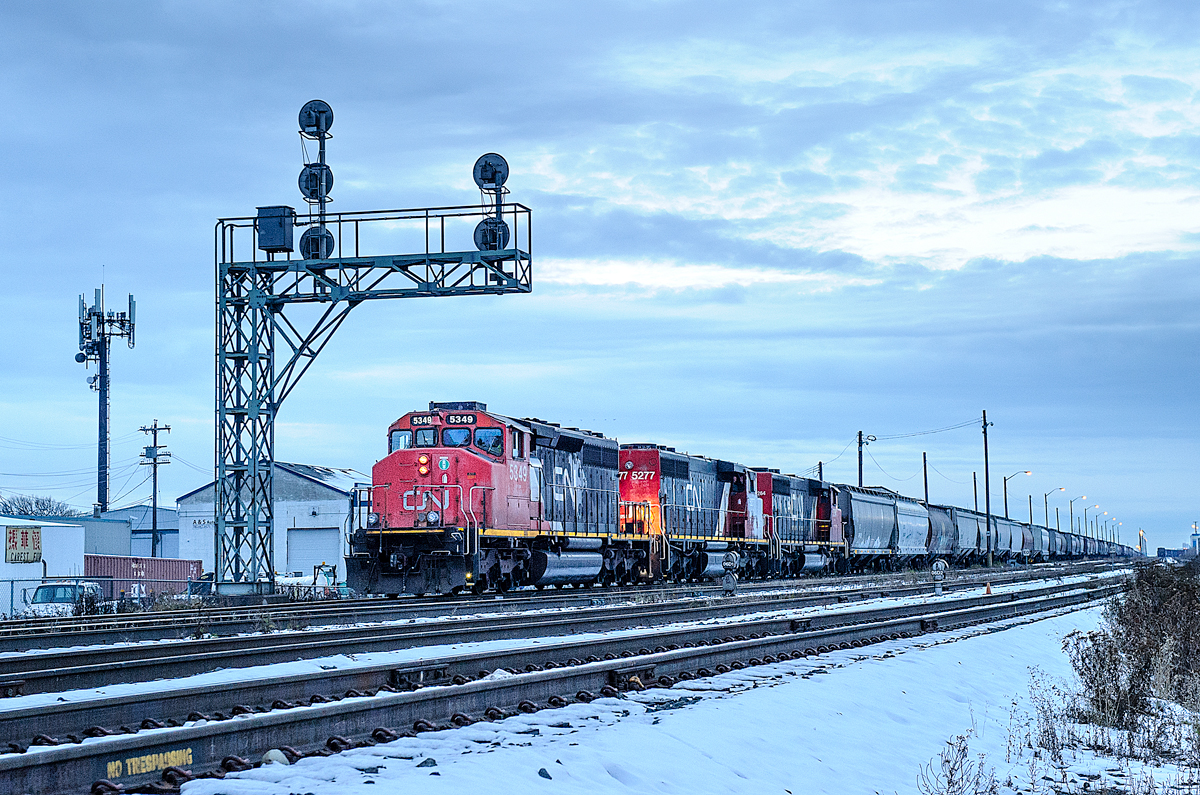 CN SD40-2Ws 5349, 5277 and 5264 depart Edmonton's Walker Yard at dusk with 100 grain empties for Gaudin, AB.