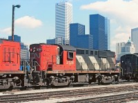 CN 3128 coupled to 3106 with the 6819 further along the track.