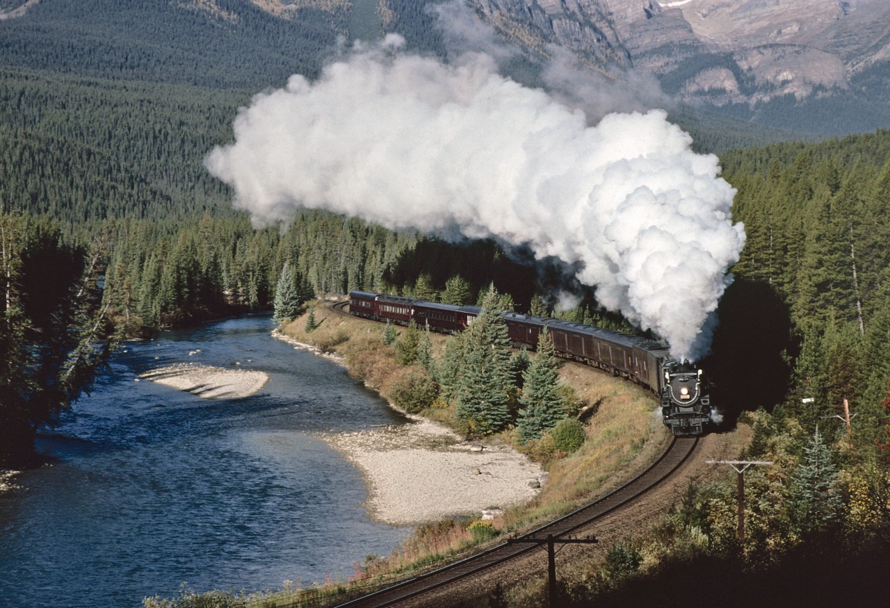 The final day of 2816's Inaugural Run from Vancouver to Calgary was magnificent.
Departure from Lake Louise was of course "on time" and with moist crisp mountain air, the exhaust from 2816 could not have been more perfect.  The train rounding Morant's Curve, MP 114 of the Laggan Sub.