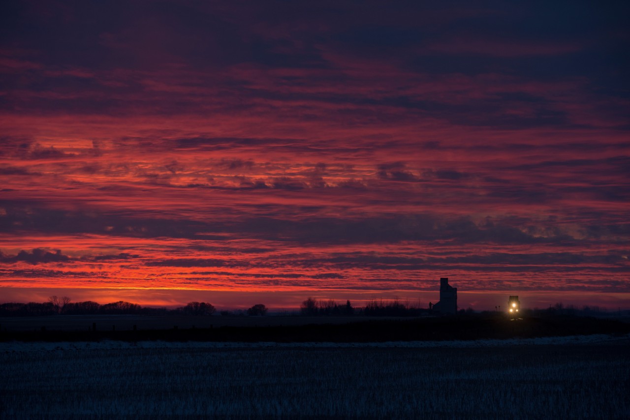 CN 112 rolls through Asquith Saskatchewan under a beautiful sunset.