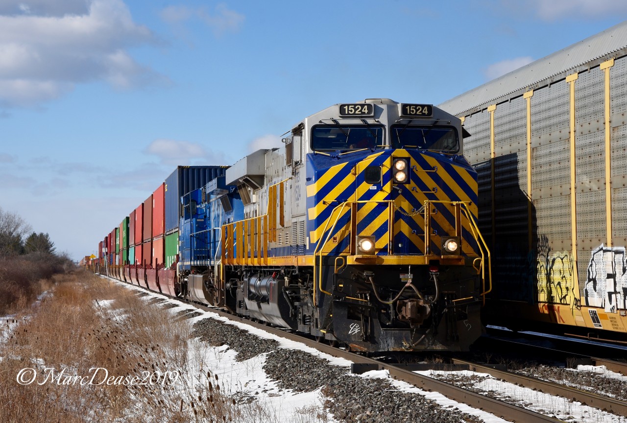 Double lease power on Train 148 with CREX 1524 leading and CEFX 1016 trailing east out of Sarnia, ON.