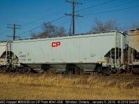 On empty grain train CP 341-008, National Steel Car hopper #650000, sits about mid-train as it slowly departs Windsor yard bound for the U.S. and more grain loading.