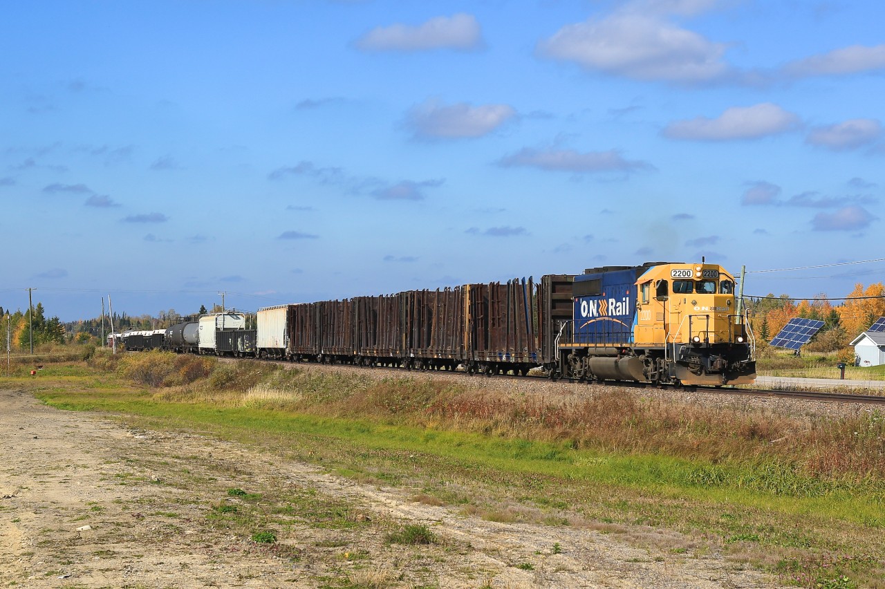 2200 leads the tri-weekly train from Hearst into Kapuskasing.  It is pictured here on the western outskirts of Kapuskasing beside the town's airstrip.