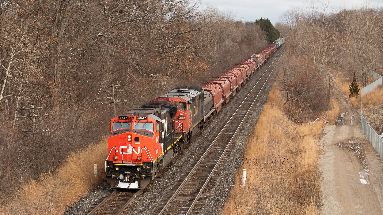 There is a relatively new pedestrian overpass in London that offers a decent vantage point of the Dundas. I was in town to see one of my favourite bands - The Constantines - on back-to-back nights at Call The Office, so figured I'd get a bit of railfanning in despite the cold. After all, I had surprisingly never really railfanned in London before aside from a few grab shots of interesting hoppers over at Quebec Street one day. I am glad we picked this location for 331, as I feel the location does justice to that nice string of coils up front. There is something about a big cut of coil cars that I really enjoy. I'd definitely recommend this spot, especially when the weather warms.