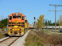I'm glad I spent a couple years getting all I could on GEXR before the lease expired - took no chances really, get your shots while you can is the motto de jour. Here's a neat shot, the Agro-Mart facility in Belton Ontario, has an almost complete loop-track set to take unit trains of Fertiliser. 516 is shoving with 17 cars into the loop track to lift 17 empties, then will set off the empties on the main, shove the 17 loads into the loop track by the loading pits,  run around the train and return to Stratford. The last unit potash trains for this facility were CN powered approx 2003, after which they resorted to sending unit trains from the west to mac yard and sending blocks of cars from mac on GEXR 431. The switch to this facility is right in the middle of the plant at Kellys hence the signals.
<br>
Agro-Mart gets service two days a week from CN 568 these days and is busy right now. I'll make it out there for that some day :)
