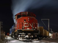 The smell of diesel exhaust hangs heavy in the air at Preston as GMTX 2274 idles away trying to maintain its internal temperature on a bitterly cold night. With a wind chill of almost -30 it’s prime mover won’t get much of a break before the mornings call to duty. In the background a worker is busy unloading the last two cars of wallboard before the local lifts the cars in the morning and takes them to Guelph with the cut of cars on the main in the distance.