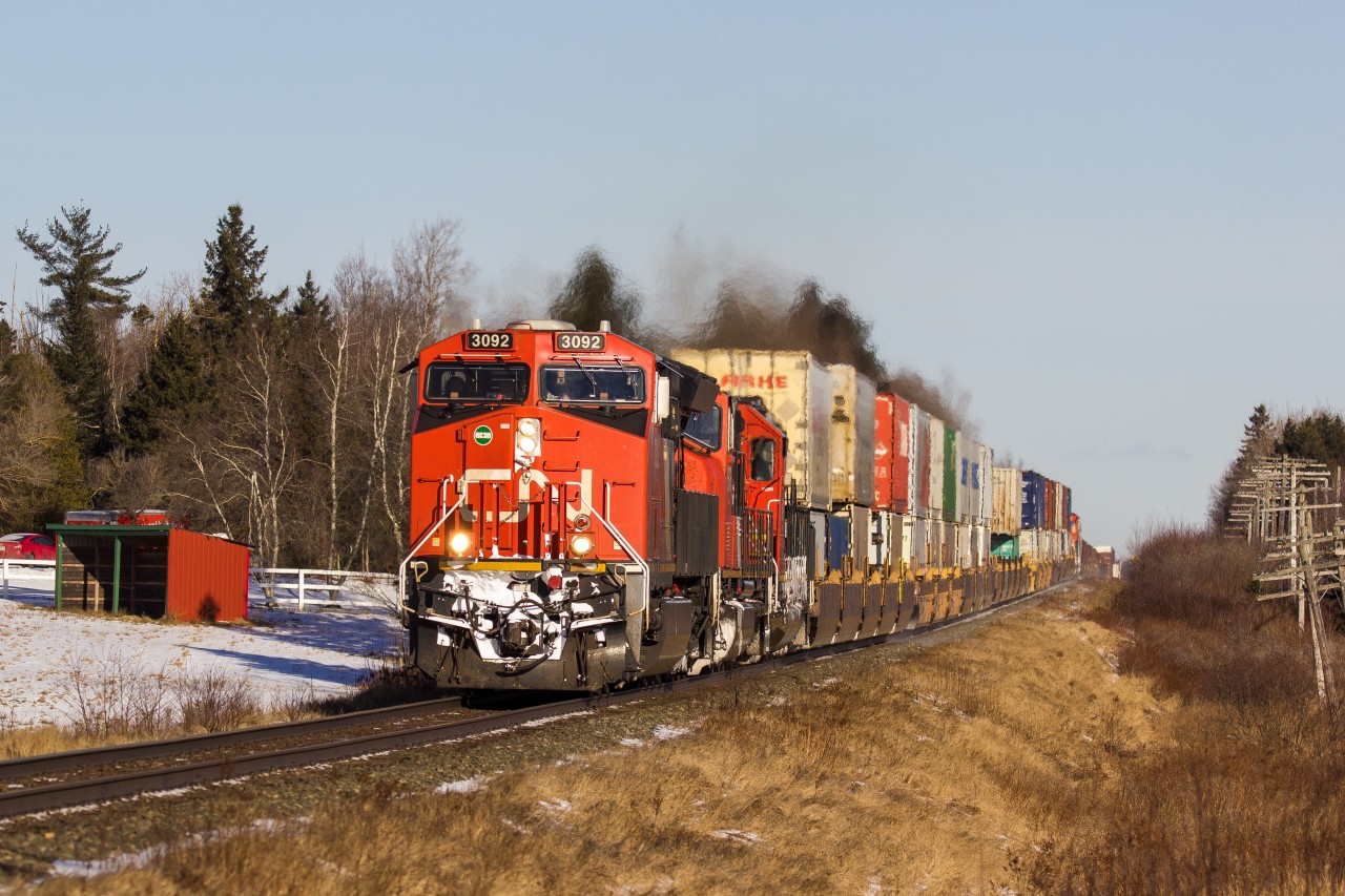 CN 3092 leads a short stack train through Brookfield heading west towards Halifax