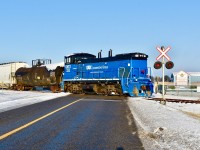 Passing by the Brampton Caledon Airport (aka Brampton Flight Centre and Flying Club) GMTX 333 crosses over McLaughlin road in Caledon as it leads it’s Friday morning freight southbound towards Mississauga. All the snow in this shot which we got in a slight snowfall the other night will be gone by the time the OBRY returns as temperatures raised to about 7°C by early afternoon. This photo was taken at 09:14