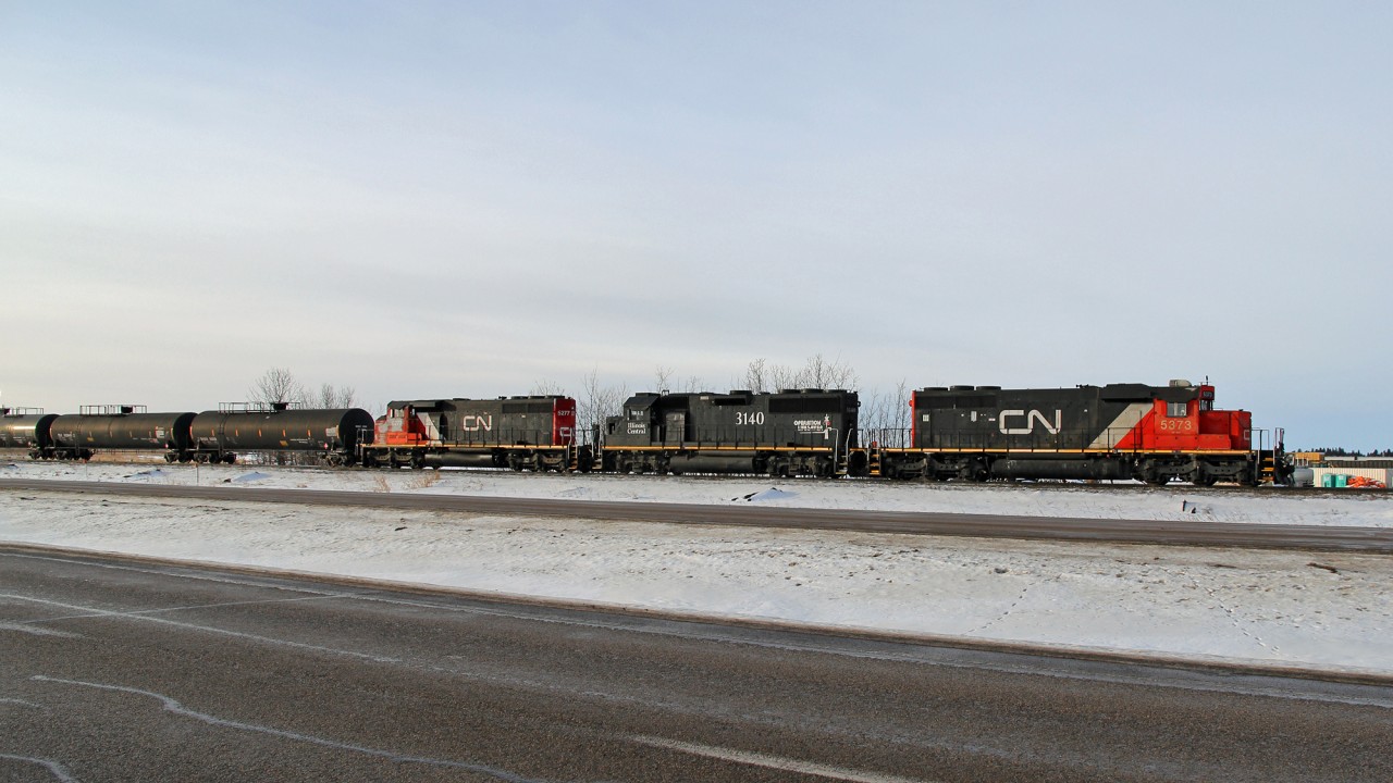 SD40-2 CN 5373 (ex UP), GP50m IC 3140 and SD40-2(W) CN 5277 are switching at the east end of CN's Scotford Yard