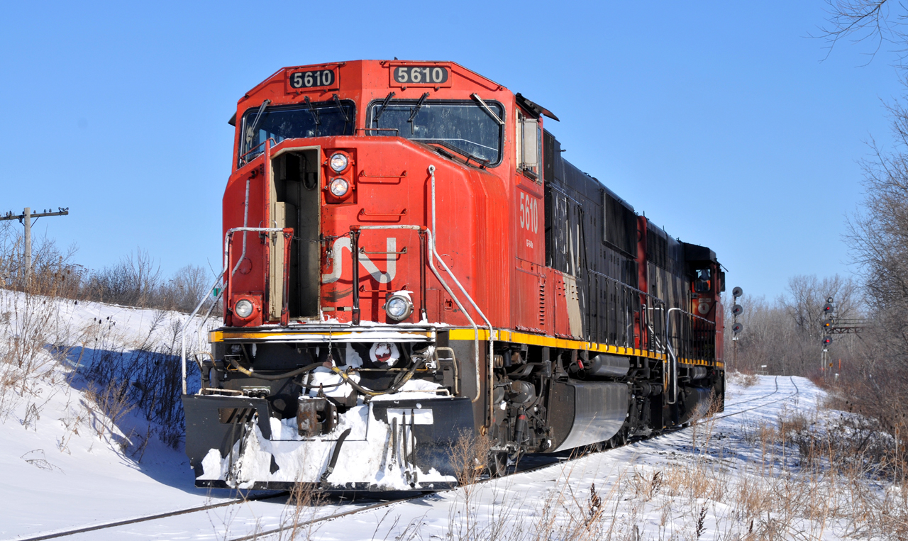 CN 5610 - CN 9543 on L58031 31 head back to the mainline after dropping a single loaded hopper at the Ingenia interchange spot underneath the Hagersville Sub