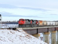 A pair of SD70M-2s, CN 8910 and 8937 cross the North Saskatchewan River at Scotford
 looking every bit like a main line road train but actually taking the Beamer industrial spur to Redwater.