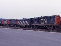 Here's one of those great 1960s lash-ups--CN RS18 3664, F3B 9001, C424 3233, GP40s 4010 and 4013 parked near the diesel shop in Hamilton. They will soon lead an eastbound freight out of town. At the time, the F3B was based in Fort Erie and the GP40s in Toronto. The 4013 was almost new, having been delivered a few months earlier, and the 3233 had been delivered in the first half of 1967.