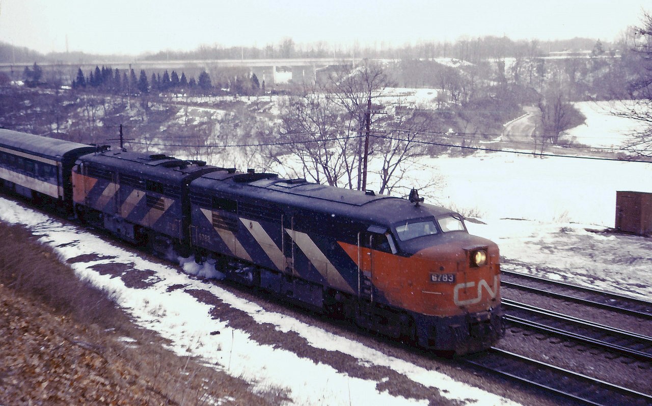 As snow flurries fly, CN 145 eases through Bayview on its way from Toronto to Windsor behind a pair of FPA4s.
