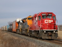 CP 3033 lead's a colorful CP 244 in Puce, Ontario.
