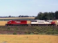 CP SD40-2 5587 & SOO SD60 6001 lead a westbound past farmer's fields at Lobo, on CP's Windsor Sub just west of London.