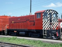 Former CP 7069 (a Baldwin DS4-4-1000) is shown at CP's West Toronto yard on June 2nd 1986. It was originally part of an 11-unit order of Baldwin switchers (7065-7075) and 13-unit order for roadswitchers (8000-8012) built in 1948 by Baldwin in Eddystone PA (the order was set up for CP via CLC) for dieselizing the E&N, and proved to be CP's only Baldwin purchase. The Baldwin fleet served mainly out west on the E&N and in the Vancouver area until the remaining units were retired during the mid-late 1970's.
<br><br>
7069 was retired in October 1978, and purchased later that month by a D.A. Lister of Toronto. It currently resides at the Toronto Railway Heritage Association's "Roundhouse Park" (former CPR John St. Roundhouse) in downtown Toronto, albeit still privately owned and not officially part of the museum's collection.
<br><br>
The only other surviving CP Baldwin locomotive was DRS4-4-1000 8000, which was set aside by CP for their old locomotive collection in the 80's, but eventually donated to the West Coast Railway Association in Squamish BC.