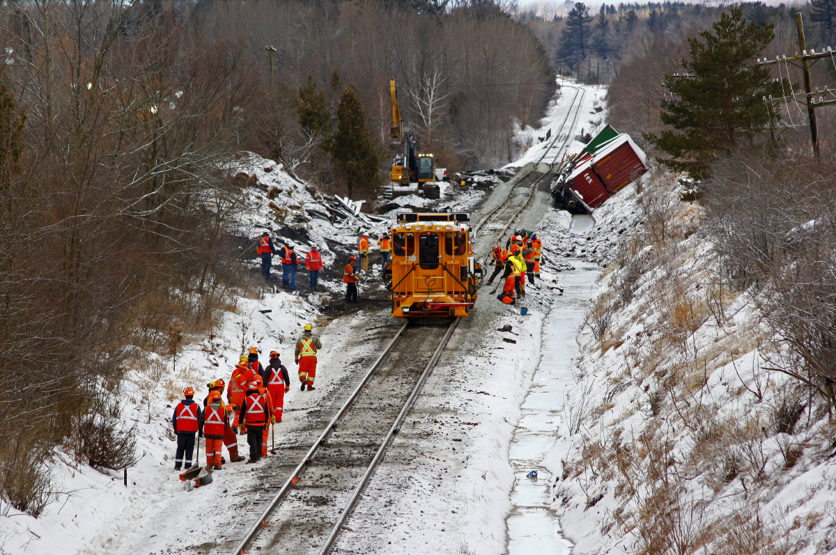 Yesterday, CP 119 hit the ground around mile 184.5 of the Belleville Subdivision. For those of you not familiar with the area, this is located in Ajax, ON between Westney Rd. and Church St, looking to the west.

Crews have been working around the clock to clean up the aftermath of a decent-sized derailment. I drove around the area and could not believe the amount of trucks and workers on the scene. It truly is amazing to see how quick and effective these guys can be during the clean up process!