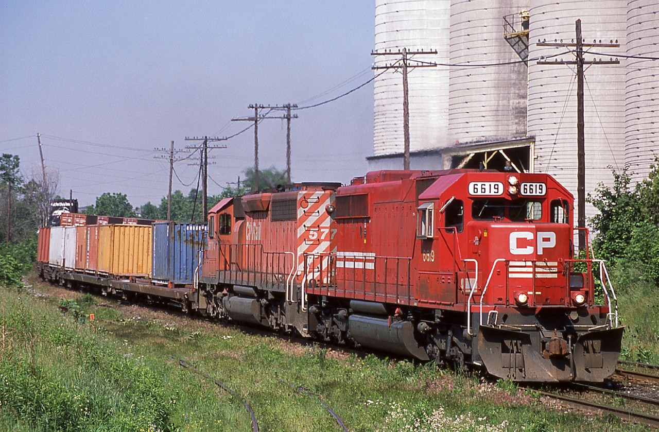 CP 6619 is seen here in it's short lived patch job leading 158 past Reid milling and the ADM spur at mile 20 of the Galt Sub.