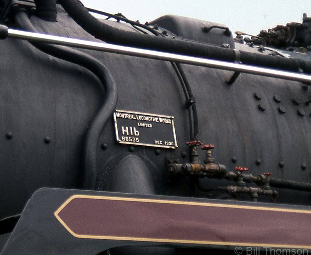 A closeup of the builder's plate bolted on the front left side of CPR Hudson 2816's boiler, proudly proclaiming her as a December 1930 product of the Montreal Locomotive works, builder's number 68535, a CPR class "H1b" Hudson.