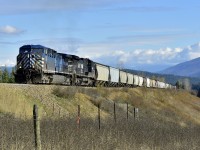 There's not a red engine in sight! CEFX 1051 & NS 8396 are crawling up the grade to Notch Hill at the head of a westbound mixed freight.