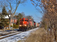 It finally happened, 431 stalled on the Acton grade last night, forcing the two units (CN 2409, 9473) to back the train from near Acton back to CN Peel at the Bramalea Station.  This morning a new crew was called to finish the trip, coming from Mac with extra power in the form of GP9u 4131.  The unit are seen dragging their 8300 tons of freight through the street running portions of Guelph just west of mile 49 on what was one of the first sunny days we've seen in quite awhile.