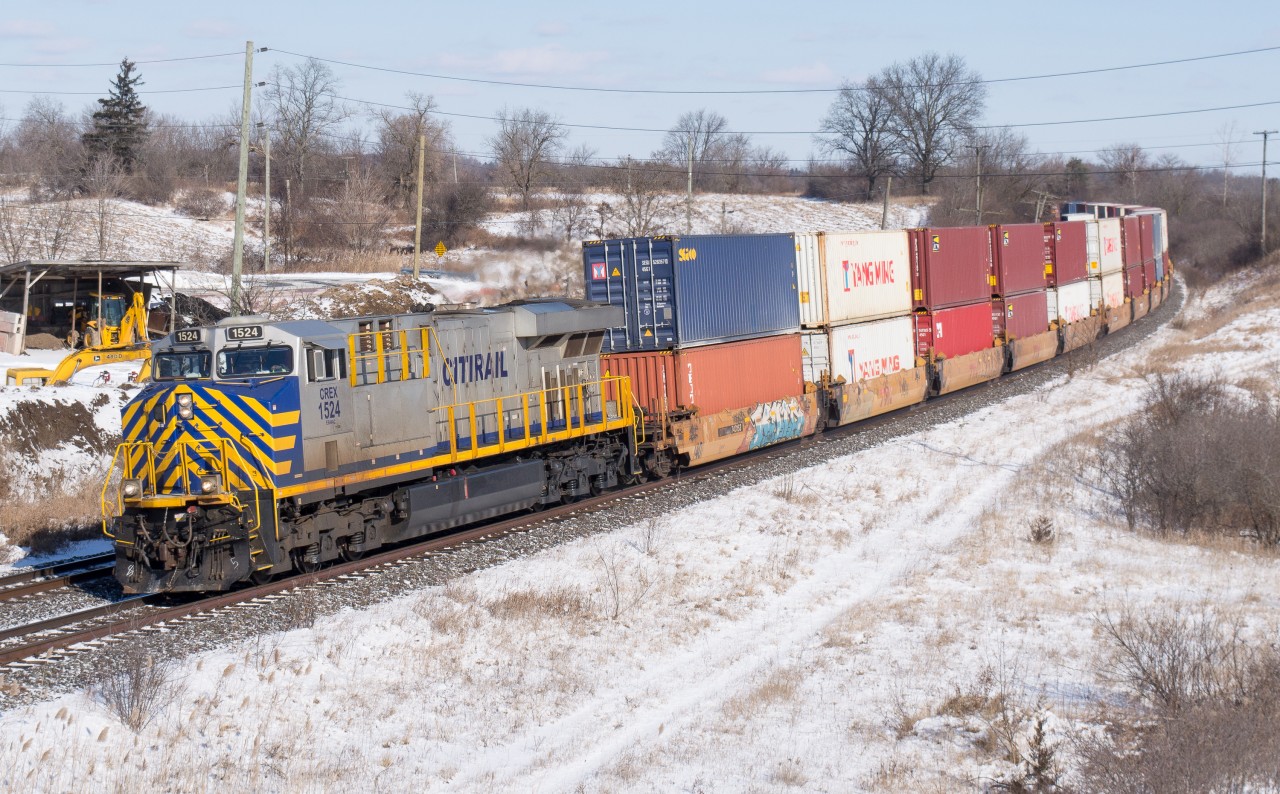 A detouring intermodal train rounds the curve at Garden Ave with CREX 1524 on the point.