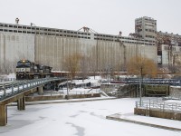 NS 9641 & NS 8022 are passing grain elevator #5 as they lead CN 543 into the Port of Montreal with traffic from Taschereau Yard.