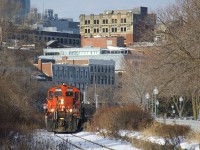 After bringing cars to the Port of Montreal, CN 7233 & CN 227 are heading back light to Pointe St-Charles Yard.