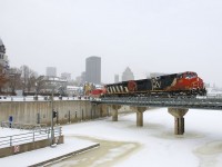 A late CN 149 is crossing the Lachine Canal with CN 2652 & CN 2409 for power on a frigid day after Montreal received a large snowstorm.