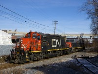 CN 7233 & CN 227 are heading back to the main line light after dropping off a single boxcar at the Kruger plant located at the end of the Turcot Holding Spur.