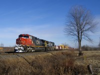 CN 2614 & GECX 7349 lead a 136-car CN 369 around a curve at about MP 35 of CN's Kingston Sub. They had just met counterpart CN 368 a few miles east of here.