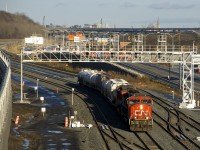CN 5734 & CN 2528 lead a very short CN 527 past Turcot Ouest as it heads towards Taschereau Yard on the new portion of CN's Montreal Sub.