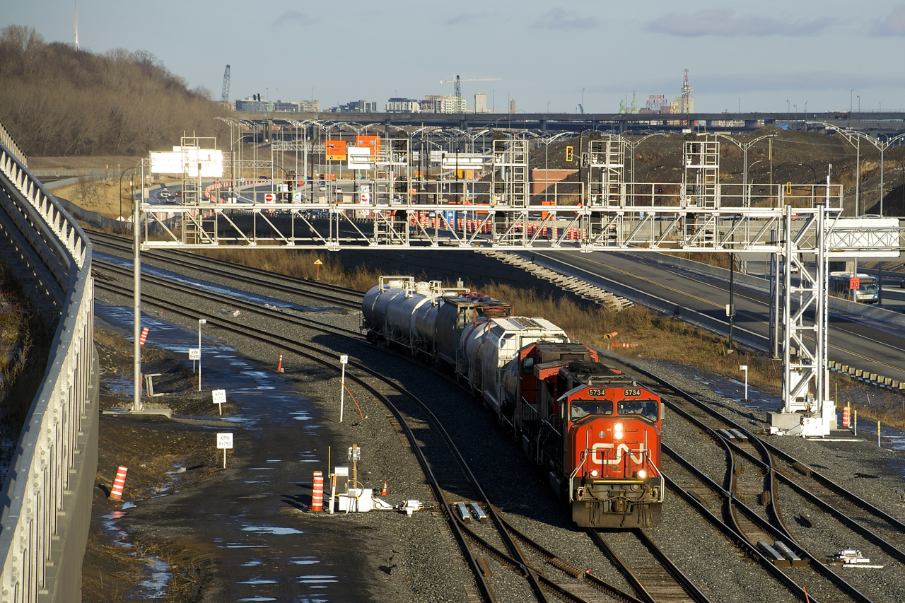 CN 5734 & CN 2528 lead a very short CN 527 past Turcot Ouest as it heads towards Taschereau Yard on the new portion of CN's Montreal Sub.