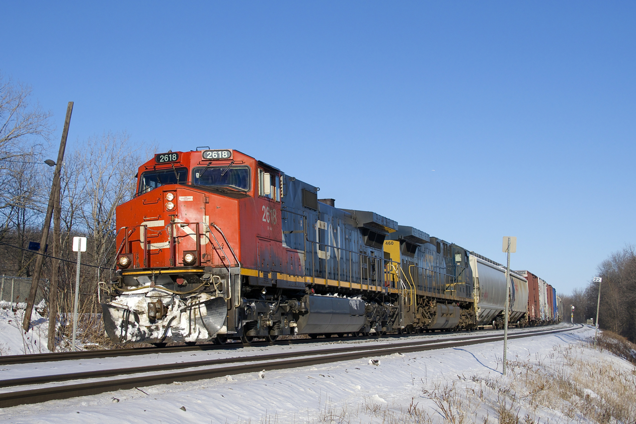 CN 2618 & CSXT 460 lead a 113-car CN 377 past MP 22 of CN's Kingston Sub on a crystal clear, but frigid afternoon.