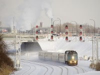 VIA 67 has VIA 6411 and four LRC cars as it rounds a curve on CN's Montreal Sub.