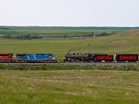 CP Hudson 2816 returning to Calgary from an Intermodal Terminal Sod Turning at Regina meets an eastbound grain empties at Hatton, last siding in Saskatchewan between Maple Creek and The Hat