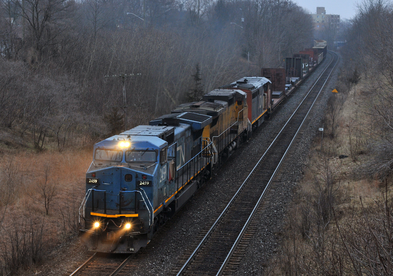 IC 2459, GECX 9130, and CN 2434 throttle up as they depart Brantford with 79 cars on CN A43531 05