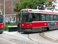 BATHURST STATION STOP. On my first Father-Son trip to Toronto in 2007 with my youngest son Thomas to watch our beloved Maple Leafs, we decided to experience their famous streetcars. Upon learning we had traveled all the way from Newfoundland & Labrador, a kind and generous TTC employee gave us a free return ticket to enjoy the 511 Route from Union Station to Bathurst. An added bonus, besides travelling through Kensington Market and Chinatown was that after the layover, the car was supposed to return empty to Union but with the exception of my son and I. What an amazing and wonderful experience we shared with the driver that afternoon, thanks to the wonderful TTC staff!Here, CLRV 4075 waits on the turn before allowing 4015 to proceed. Both of these Class L2 cars were 2 out of a group of 190 built for the TTC between 1977 and 1981. This Fall, I plan to release my third 'then & now' book, this time on the streetcars of St. John's.