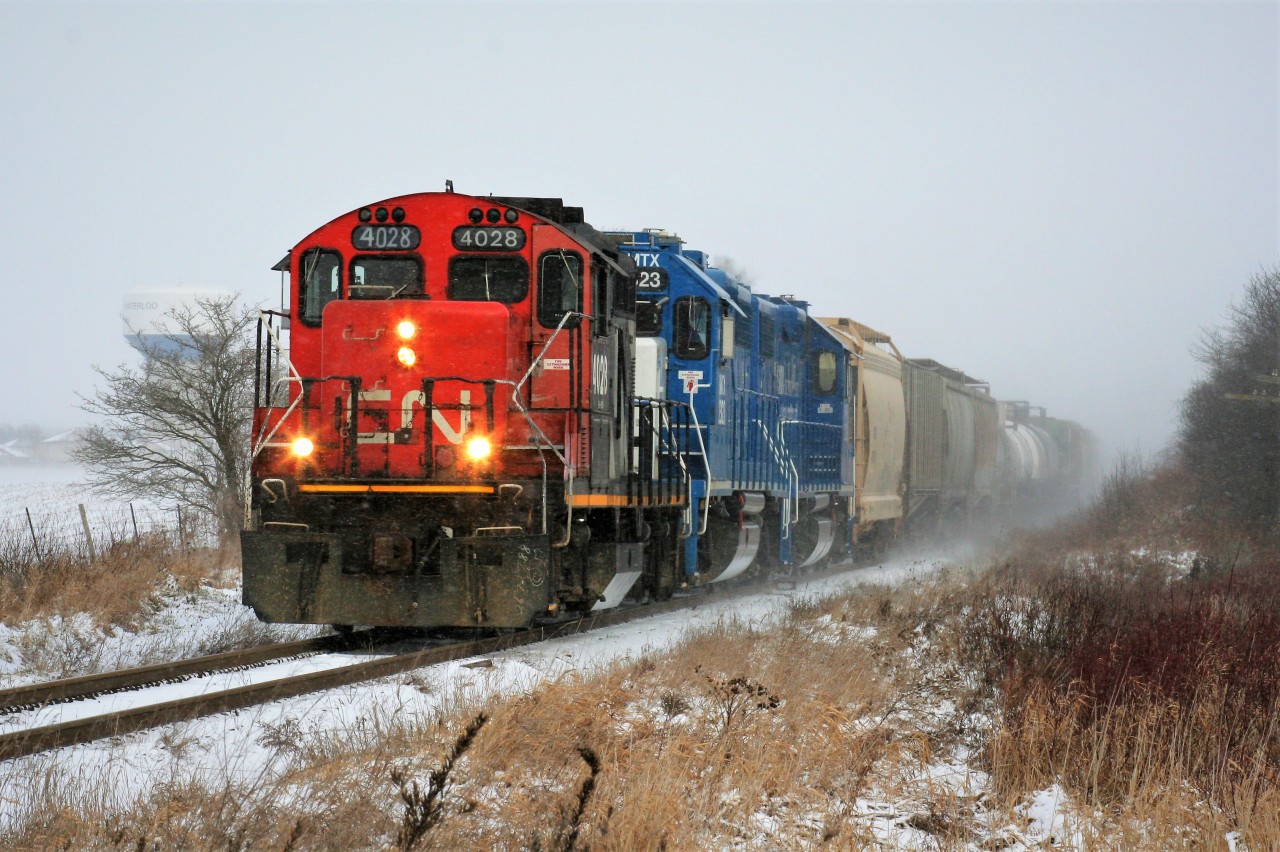 Over two decades later, and today I was able to once again photograph a CN GP9u leading a train on the Guelph Subdivision. During the mid to late 1990’s these units were assigned to every local train operating over the Guelph Subdivision and related spurs, so seeing one still earning it’s keep 20 plus years later was a welcome sight. L568 is just west of Baden with CN 4028, GMTX 2323 and GMTX 2279 as it approaches Nafziger Road.