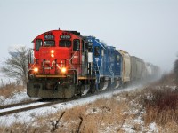Over two decades later, and today I was able to once again photograph a CN GP9u leading a train on the Guelph Subdivision. During the mid to late 1990’s these units were assigned to every local train operating over the Guelph Subdivision and related spurs, so seeing one still earning it’s keep 20 plus years later was a welcome sight. L568 is just west of Baden with CN 4028, GMTX 2323 and GMTX 2279 as it approaches Nafziger Road. 