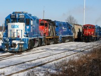 With CN having taken-back operations of the Guelph Subdivision over two months ago, the motive-power operating on jobs has almost had a retro feel amongst the modern-painted GMTX four-axle power assigned. Era's collide at Kitchener yard on the coldest day of 2019 so far, as train L568 departs on the left for Stratford with GMTX 2323, CN 4028 and GMTX 2279 as train L540 waits in the siding with CN 1439 and GMTX 2289 after returning from Guelph. 

