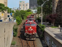 I can't say I ever shoot much on the CP mainline, mostly because activity is infrequent and the power is usually mundane. I did however want to get a shot of a train coming into the Hunter Street tunnel and a train coming out of the tunnel, and I managed to do both on June 10. Here, 8910 leads 255 into the tunnel with the former TH&B Station in the background. I find it hard to believe this tunnel used to be double track. Sure would have been fun to watch the TH&B geeps ply these rails.