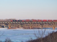 One of CN's new GEVOs is on point as 119 crosses the South Saskatchewan River on a cold November afternoon, continuing its journey westward after a brief stop in Saskatoon. Something I am sure we can all relate to: I was nowhere near this location when I heard them beginning their conversation with RTC about departing, but knew I wanted to get at least one shot on the bridge while I was there. So it was somewhat of a scramble using Google Maps on my phone to identify a spot, drive over, and then walk/run down a hilly and snow covered trail to this location. But, I made it in time, and as we all know, that's what matters most. 
