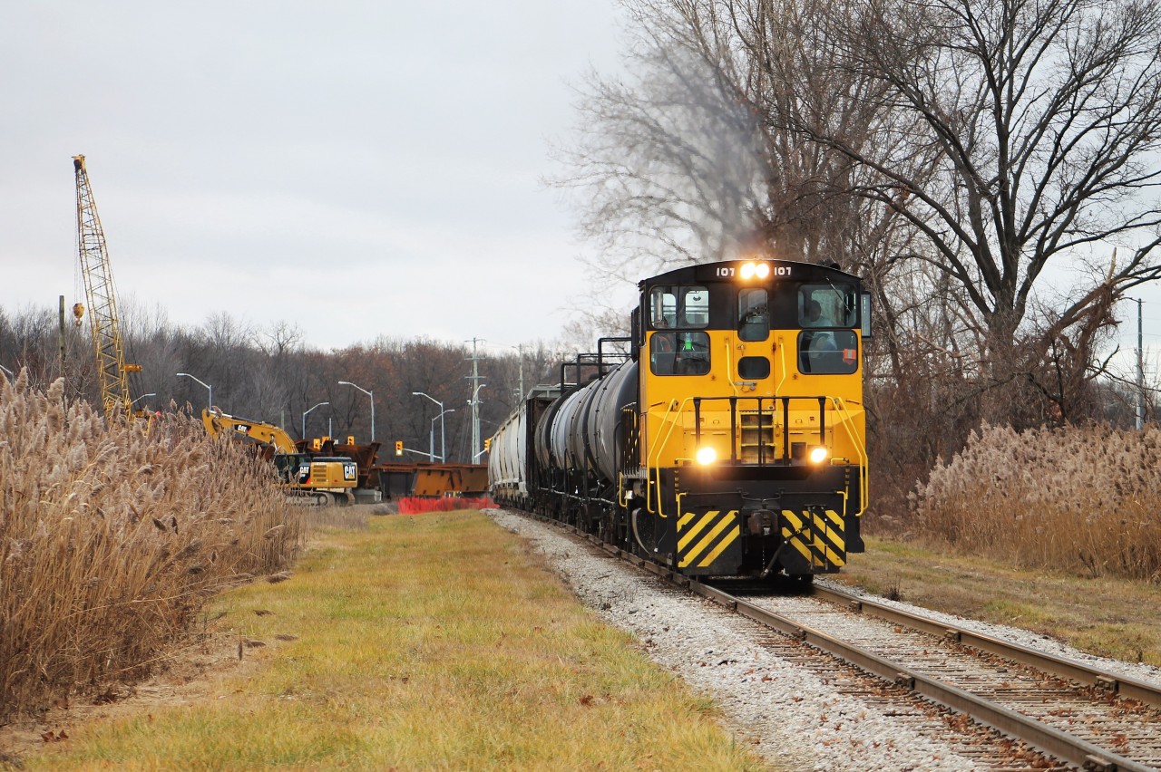 After working around Ojibway all morning, the 7am job heads back east to work a few more customers before heading to CP and CN to interchange traffic. The construction in the background is part of the Gordie Howe International Bridge project. The 401 (which currently ends at Ojibway Parkway) will cross the parkway and the tracks. A toll plaza and what I assume will be Duty Free stores will be on the other side before the bridge. As of now the expected year of completion for the entire project is 2024 and will probably be one of the most significant infrastructure projects in North America over the several years.