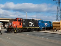 The 07:00 yard job has finished up at Parkdale Warehousing and will soon be heading back to Stuart Street. This is the last stretch of track and furthest customer on the N&NW Spur here in Hamilton, and is a location in which I have not seen shots of in the public realm before (either SOR or CN), though I am sure they do exist. I myself have a few shots of the one time I witnessed SOR switch this customer, but I have not yet posted them anywhere. Under SOR, this was a predominantly nighttime job, although I did get lucky and witnessed it in daylight the one time. When I saw SOR do it, they came in with one unit (4001) and two loads: a bulkhead and a boxcar. They used the minimal headroom (check it out on Google Maps - it really is minimal!) to lift the three empties one at a time, placing them adjacent to Parkdale Ave, before spotting the loads. CN however came in light power with two units, lifted the empties and shoved them towards Adams Yard (dropping them in the area between Strathearne Ave/Dominion Rd and Kenilworth - not sure if this is considered Adams Yard or not, so if you know please enlighten me). They then grabbed the two loads and came back to spot them before heading back westward light power to grab the empties they'd just lifted. This is how I always imagined this move taking place and was caught off guard the day I caught SOR here. Perhaps under CN this has become a predominantly daytime move and something others will be able to get shots of as time goes on.