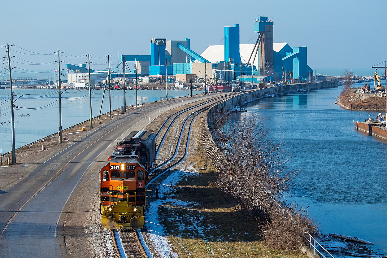 GEXR ran out to Goderich today, departing Stratford this morning with one grain hopper (presumably), four salt loads, and about eight or so Potash Corp hoppers. The salt was set off in Seaforth at Smith Packaging (which seems like a rather interesting operation), the potash in Clinton, leaving one hopper for the trip to Goderich. They ran around their train at the station, and shoved the lonely hopper down the hill to the Port of Goderich. They set it off a little past the switch that it is sitting on in the picture. I believe it was for the elevator in the Port, as it was not one of the two bay hoppers typically seen at the mine, but rather a three bay rib-sided hopper. We got the impression that they were expecting to lift loads from the salt mine, but as you can see none were ready for them, so they departed light for the return trip to Stratford. It looked as if they were contemplating work at the elevator east of Mitchell on the way back, but continued without making a lift there either, making for an entirely light power run from Goderich to Stratford.