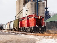 Having grown up in Norfolk County, it always bothered me that I didn't have a shot of a train on home soil. Even in the way of memories of trains in Norfolk, I have very few: I remember a CN wayfreight going through town on the Cayuga Sub in Simcoe as a kid, I remember hearing them blowing for a crossing in Nixon once when we were visiting family friends (and me being sad that I was missing a train), I remember seeing lights way in the distance on the CASO once when passing over top on highway 24 (I was always sure to quickly look both ways as we passed over) in what was likely during the era when CSX was running trains from Detroit to Buffalo, and I remember seeing the St. Thomas and Eastern coming through town a number of times when I spent a couple summers working in Delhi. But unfortunately, I did not have a shot  to capture any of these memories. 

All that changed today when I caught OSR in Courtland. It was a mostly overcast day, however the clouds were kind enough to part ever so slightly for a brief moment to shine some light on the train for a couple of shots as they lifted a few empties and dropped a couple of loads. Interestingly, there is a new owner of the facility in Courtland and rail service seems to have picked up. For now, they are slowly working their way through 40 carloads being shuttled back and forth from the interchange in St. Thomas and further to London. I would be guessing if I said this carries long-term promise, but one can always hope.